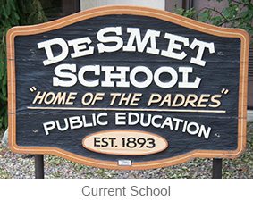 a blue sign that says DeSmet School 